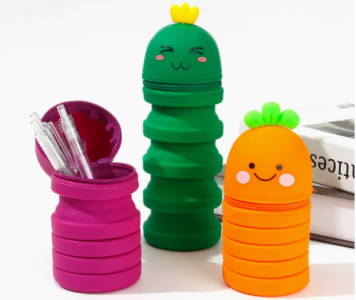 three carrot shaped standing pencil case