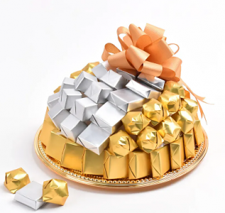 chocolates in golden wrapper in a platter