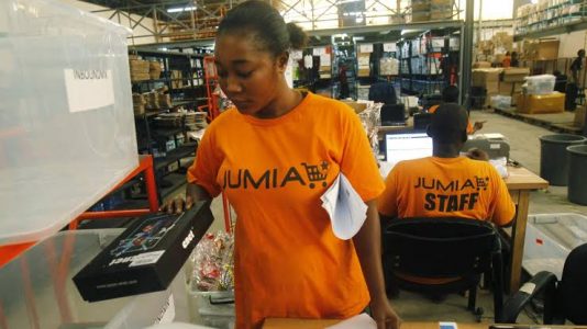 Jumia girl worker checking product
