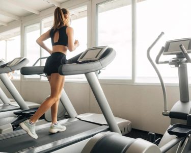 a girl running on a treadmill